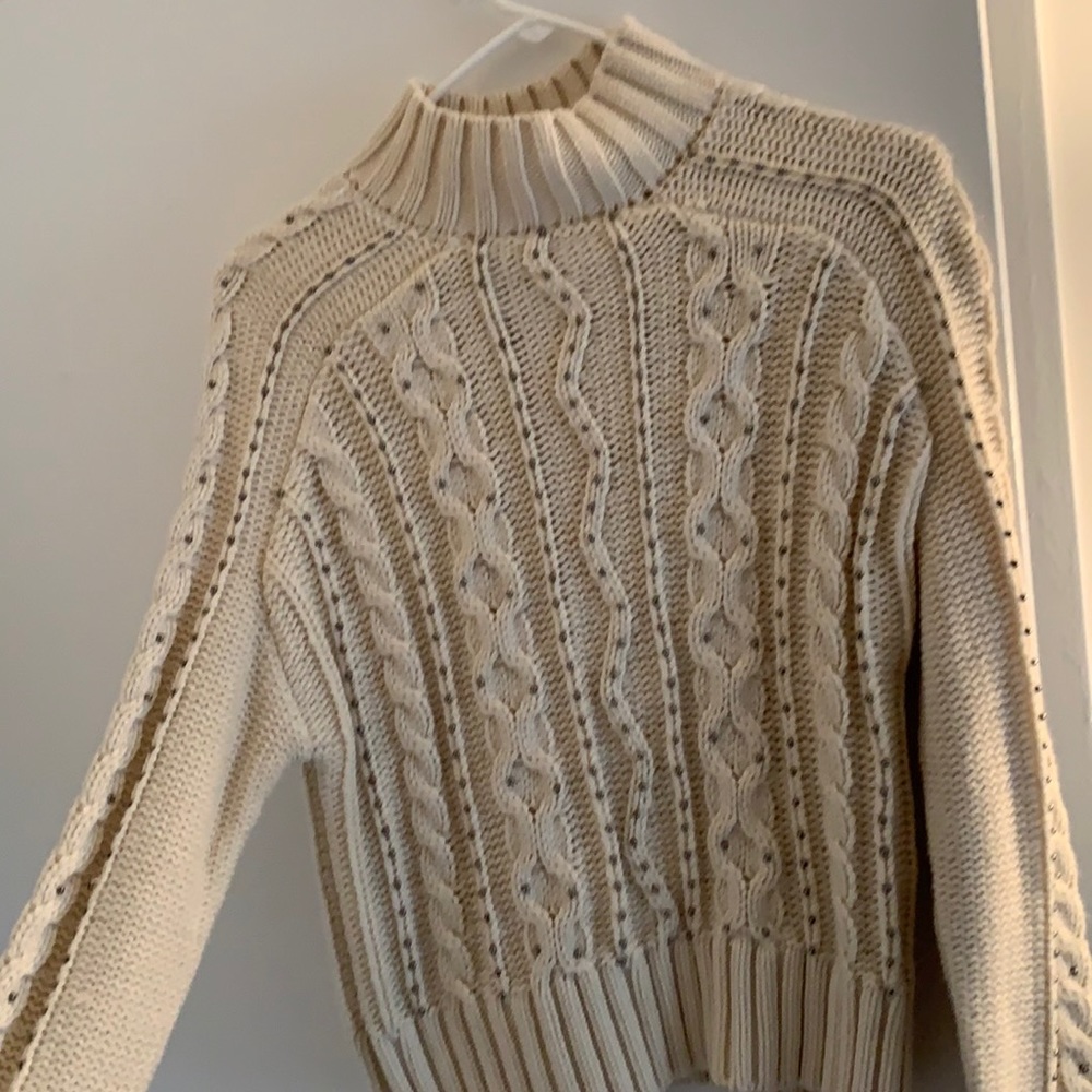 Tan turtleneck with beading from Design Lab